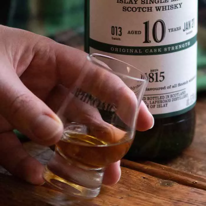 A glass filled with Laphroaig 10 Cask Strength